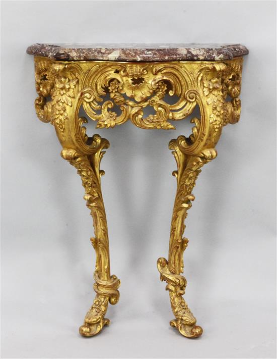 A Louis XVI style elaborately carved giltwood console table, W.2ft 1in. D.11in. H.2ft 8in.